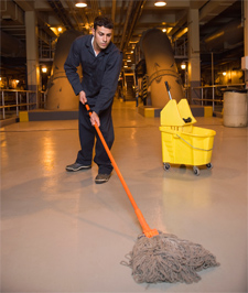 Janitor mopping the floor of a commercial building